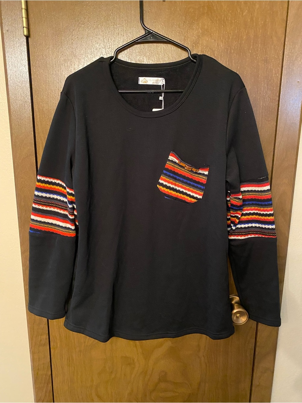 Black Long-Sleeve Women’s Top with Multicolor Stripe Pocket & Sleeve Accents